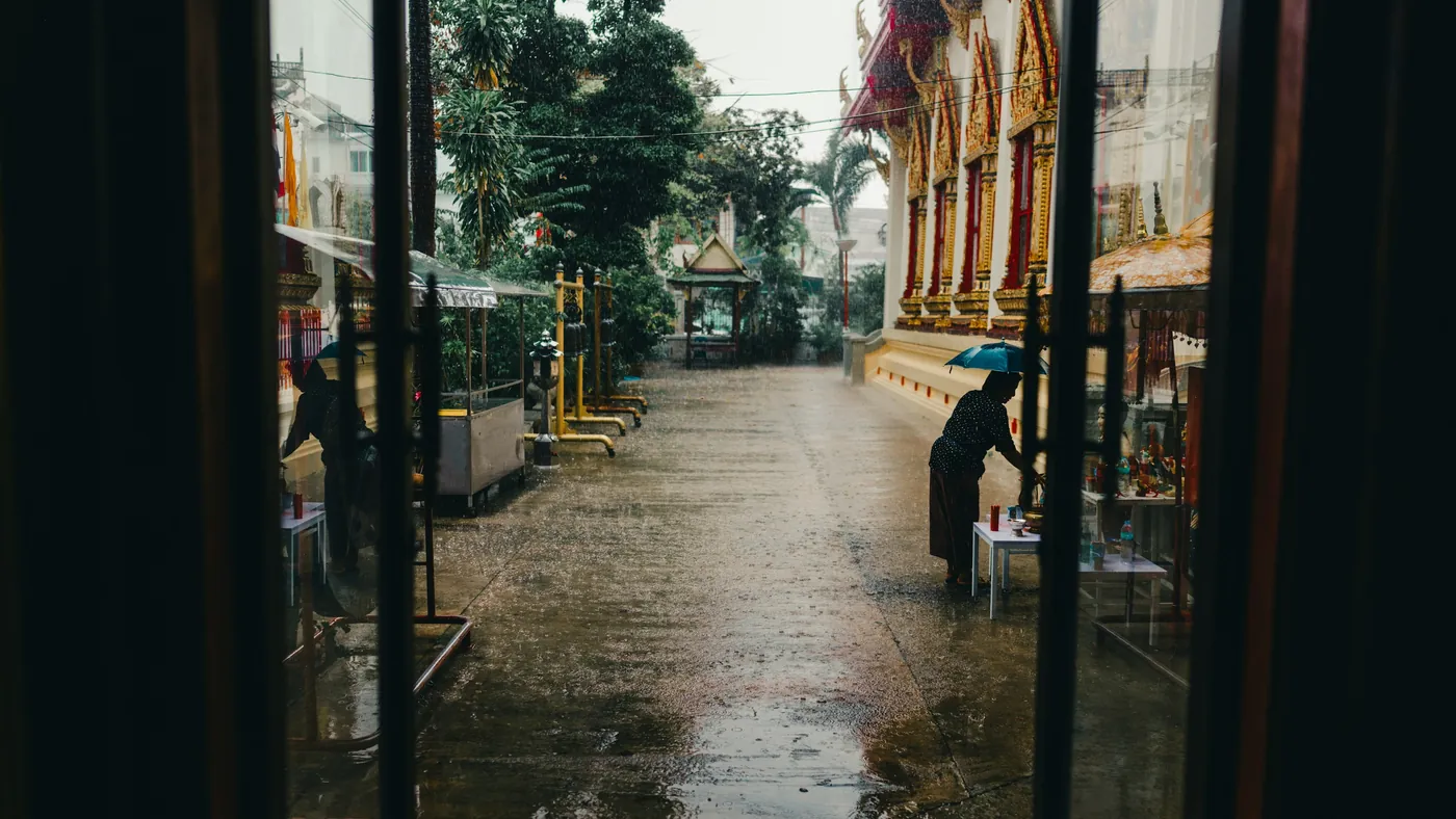 Quiet Bangkok temple courtyard after rain
